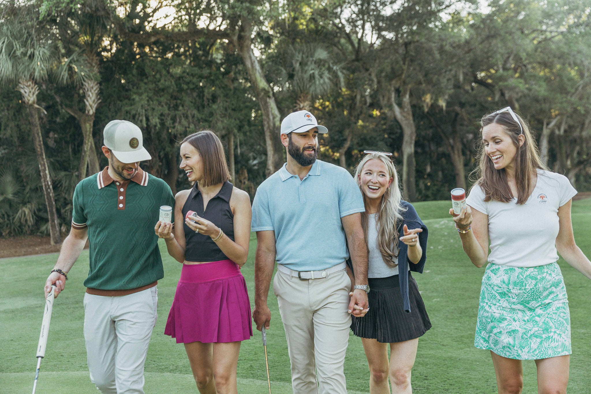 Five golfers on a golf course, each holding bad day balls.