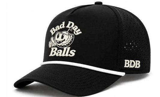 A black baseball cap with a white embroidered 'Bad Day Balls' graphic featuring a golf ball character, and 'BDB' embroidered on the side, shown on a white background.